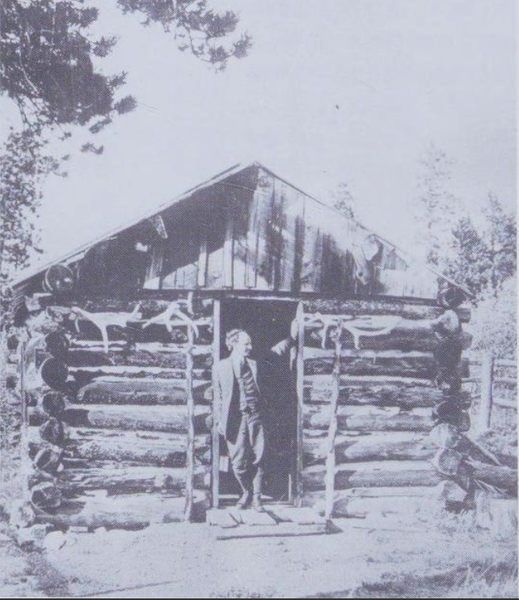 Enos_Mills_at_the_door_of_the_cabin_he_built_as_a_teen_on_Longs_Peak.png